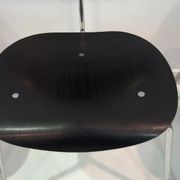 Set of four Egon Eiermann model SE 68 chairs in black lacquered plywood and steel.
