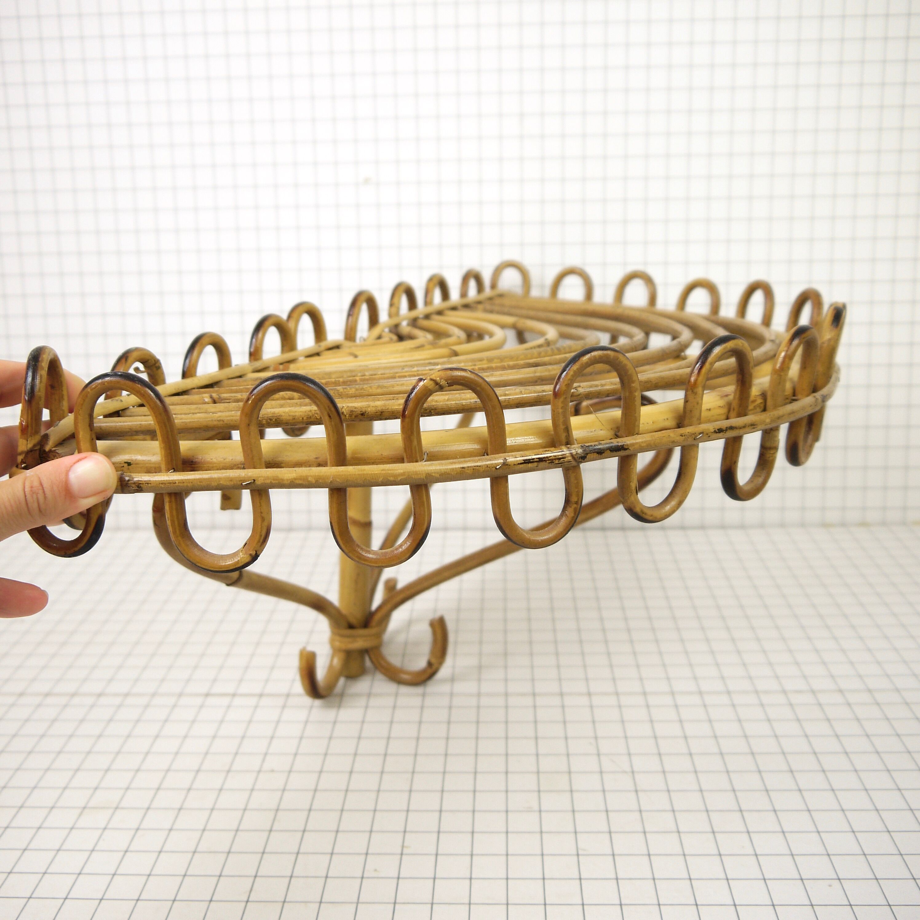 Half-moon rattan shelf and coat holder