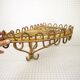 Half-moon rattan shelf and coat holder