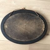 Old oval mirror with wooden frame