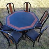 Octagonal table paul michel and its black lacquered chairs and elm magnifying glass