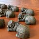 12 elongated brown bear-shaped knife rests