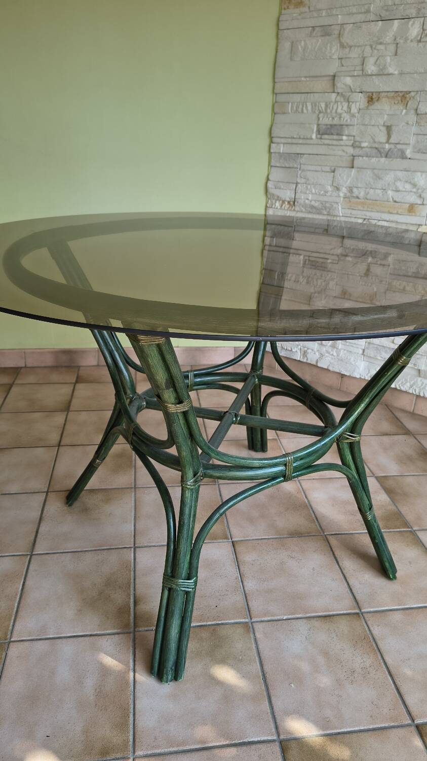 Round bamboo rattan table with a glass top.