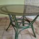 Round bamboo rattan table with a glass top.