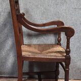 Renaissance-style armchair in solid wood, featuring a columned back