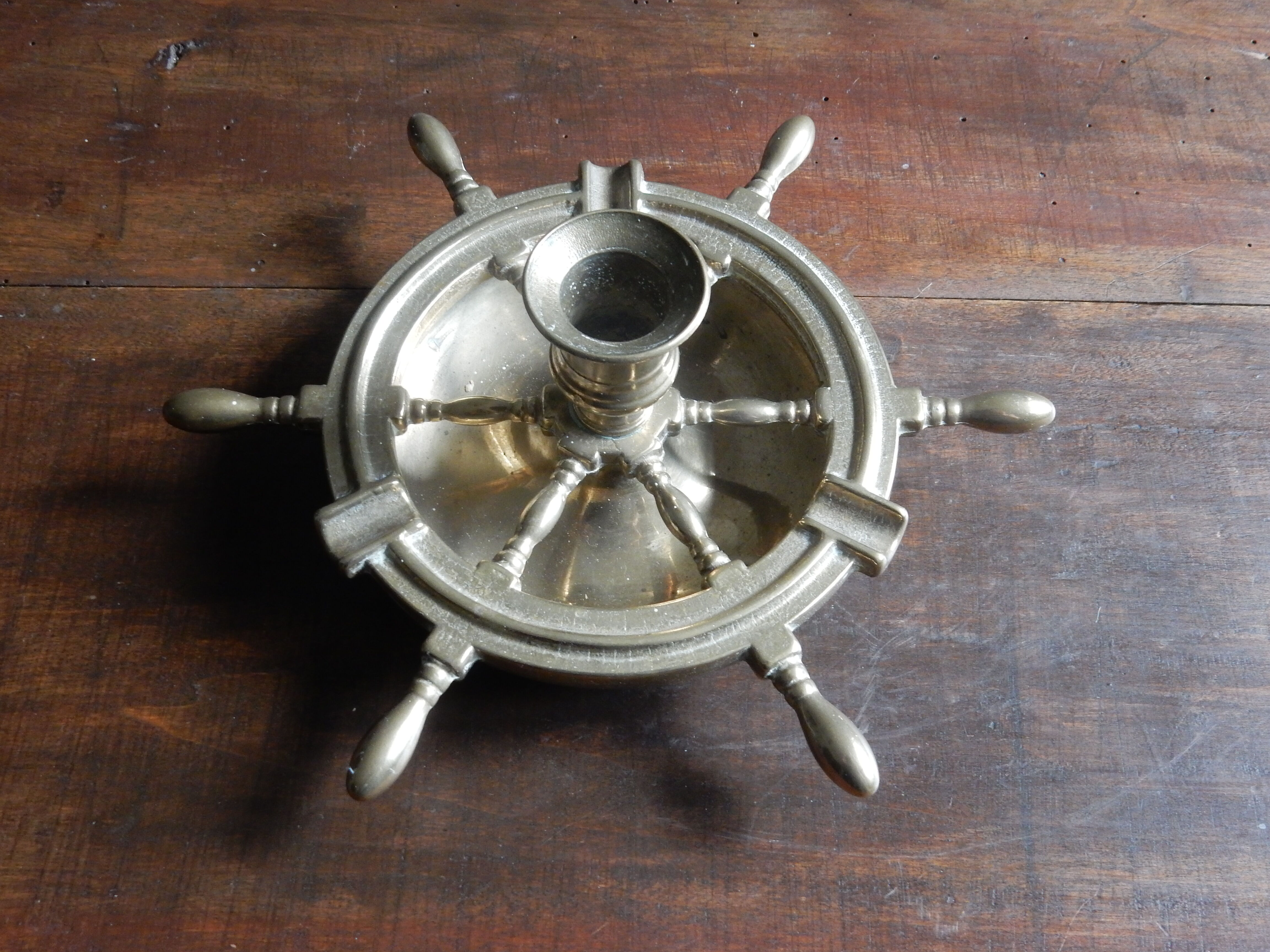 Brass ashtray and candlestick shaped boat bar