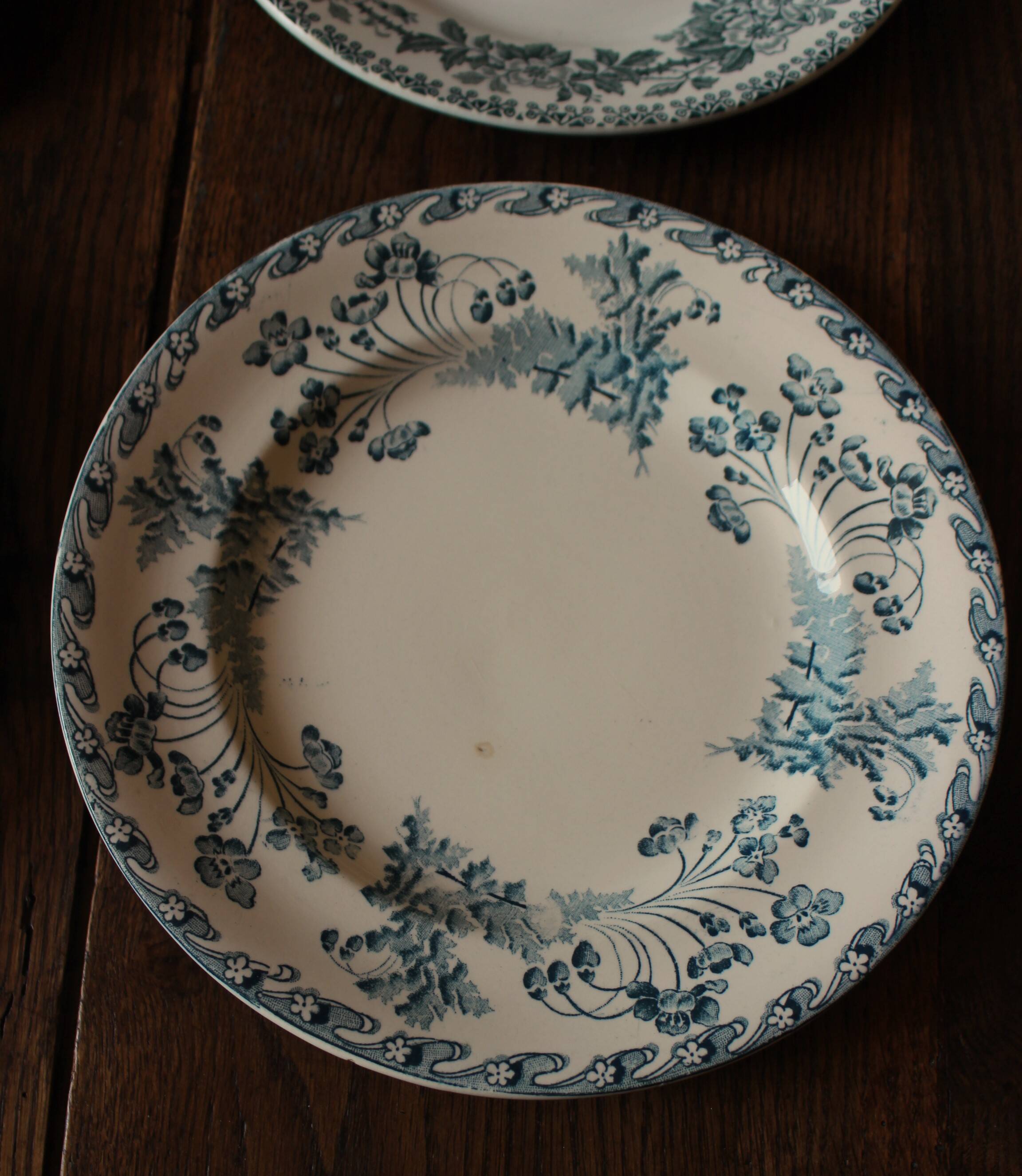 Set of 4 mismatched blue flat plates