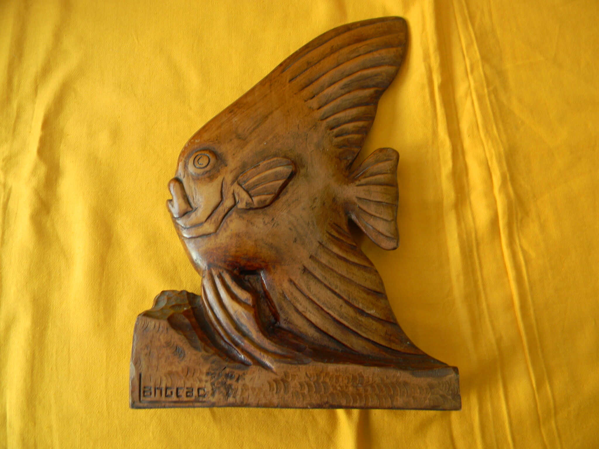 Wooden sculpture representing a langeac fish