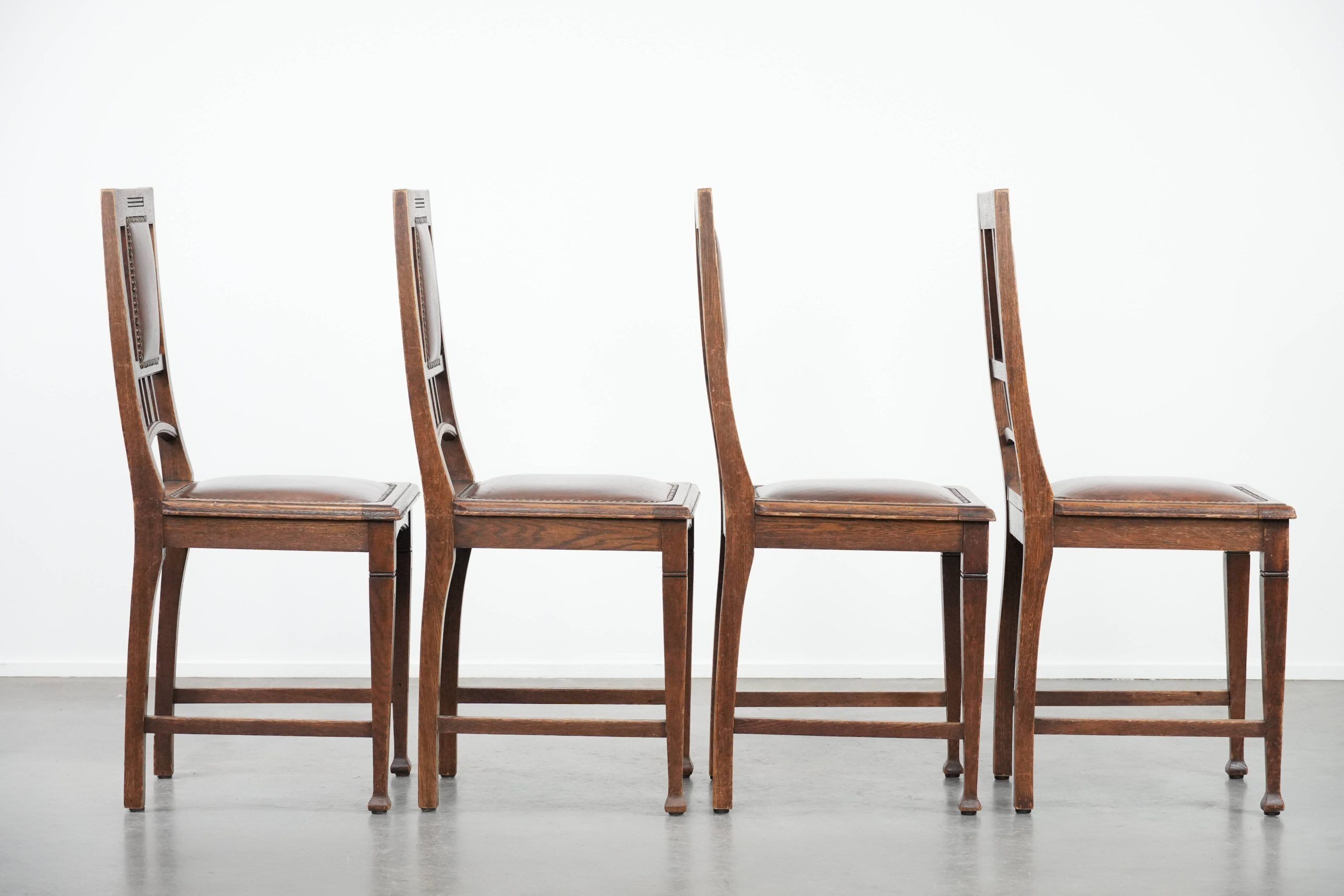 Set of four antique oak dining chairs in Art Nouveau style
