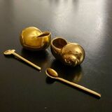2 Snail-shaped salt pots in gold-colored porcelain