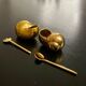 2 Snail-shaped salt pots in gold-colored porcelain