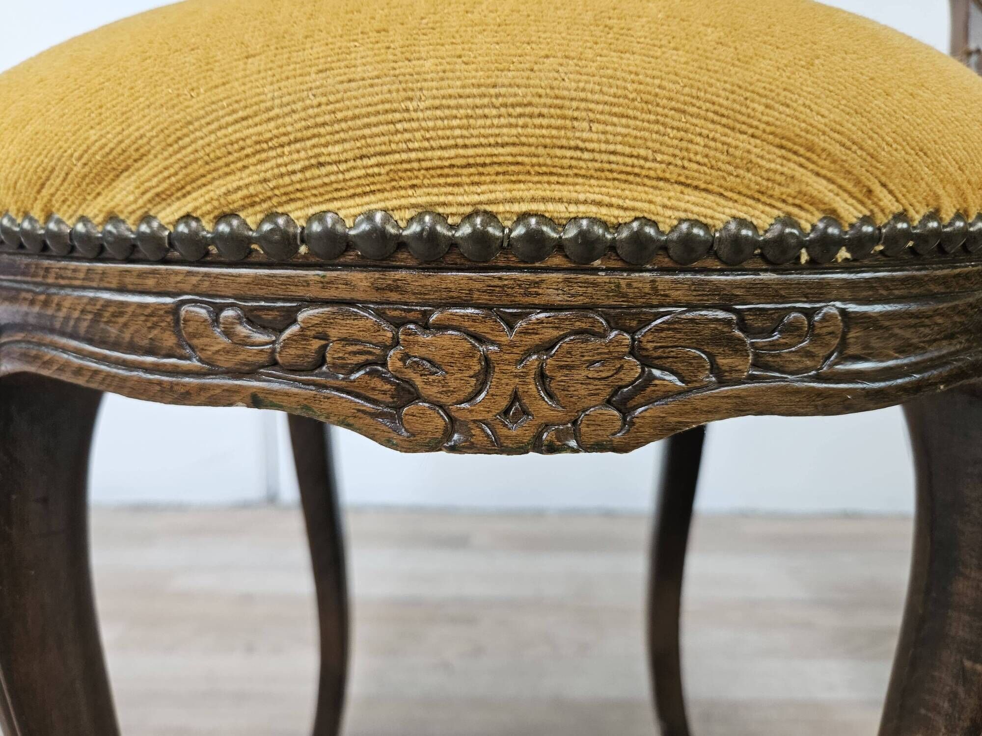 Pair of early 1900s wooden chairs with padded seat and backrests