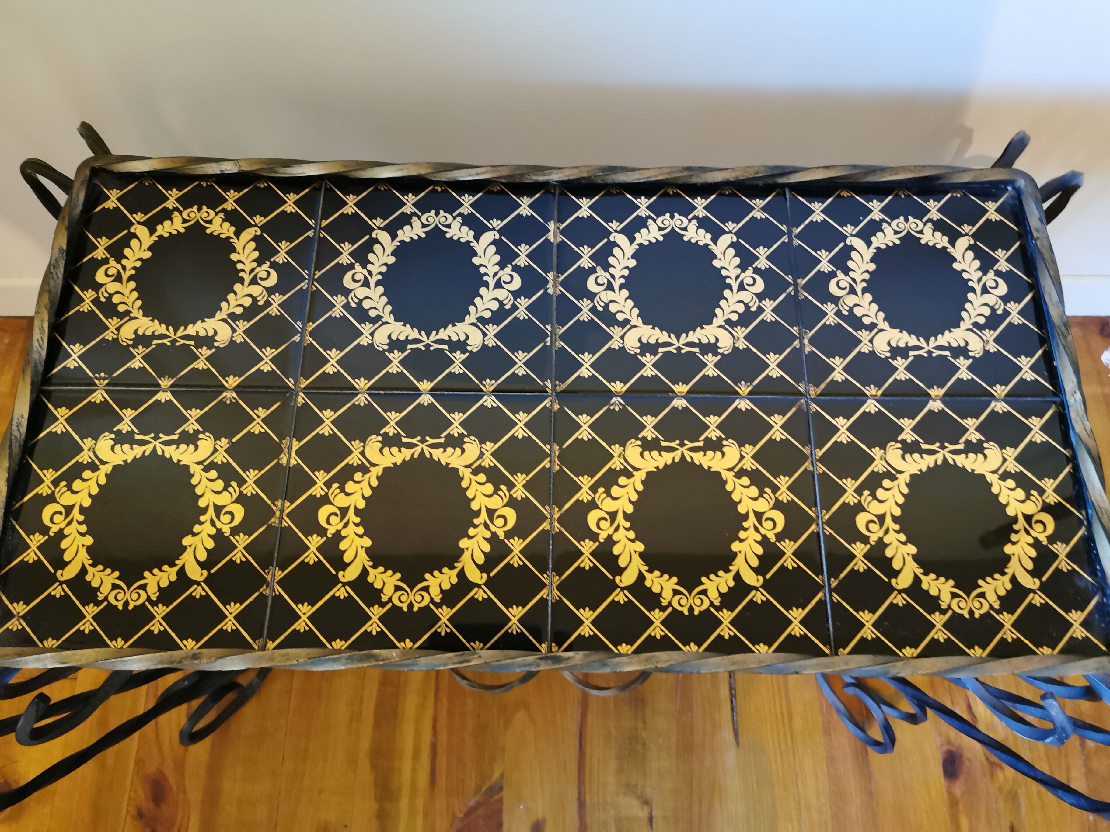 Vintage coffee table wrought iron and black and gold ceramic