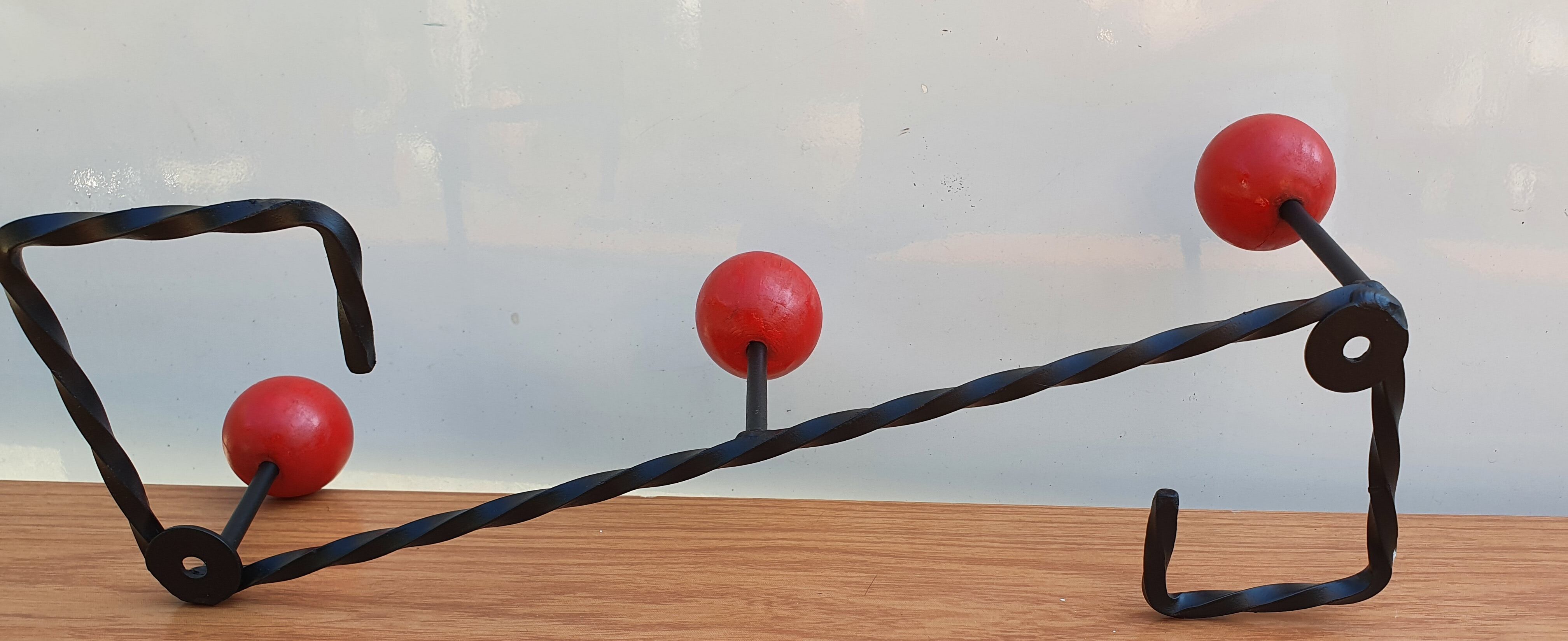 Coat rack wrought iron and red wooden balls
