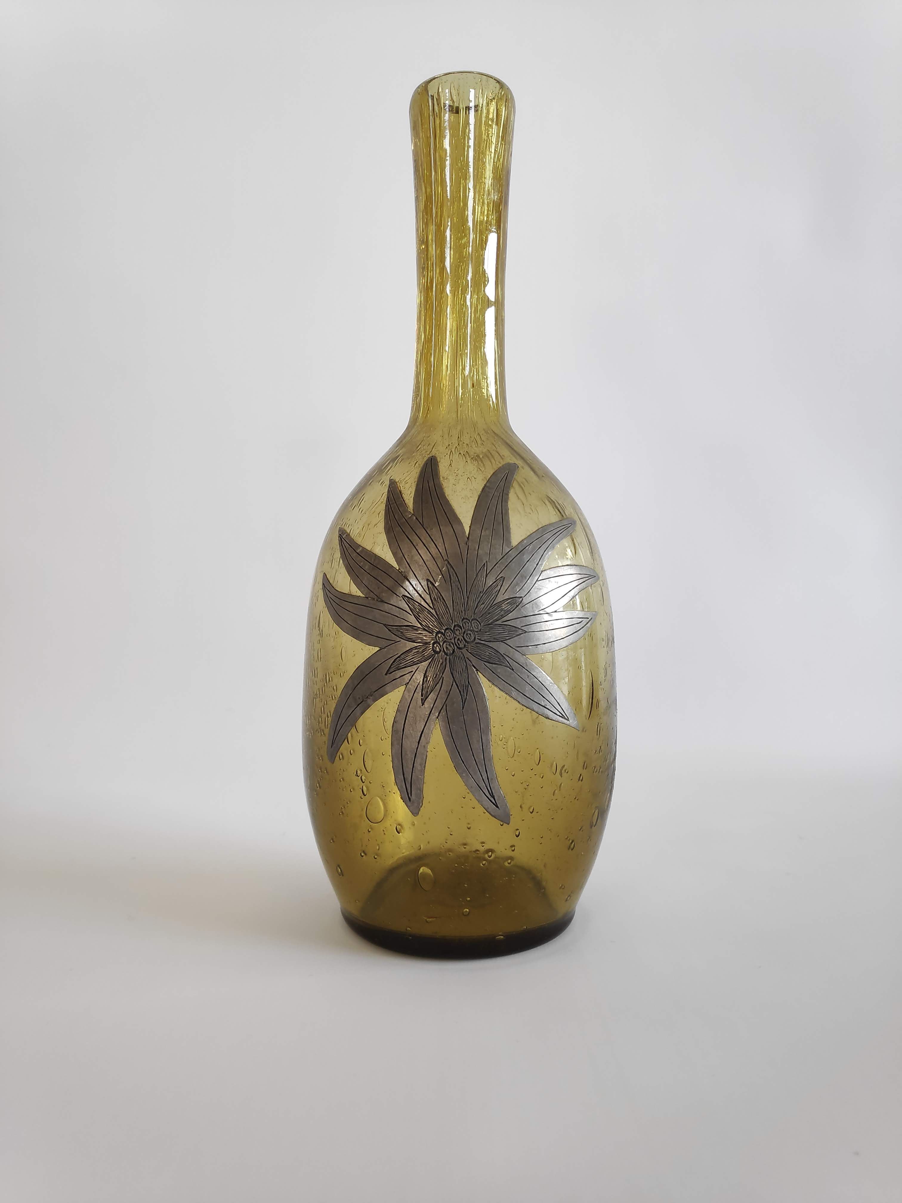 50-year-old soliflora vase in green bulled glass and pewter flower