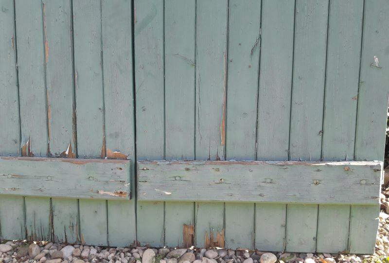 Pair of large wooden iron hanging shutters