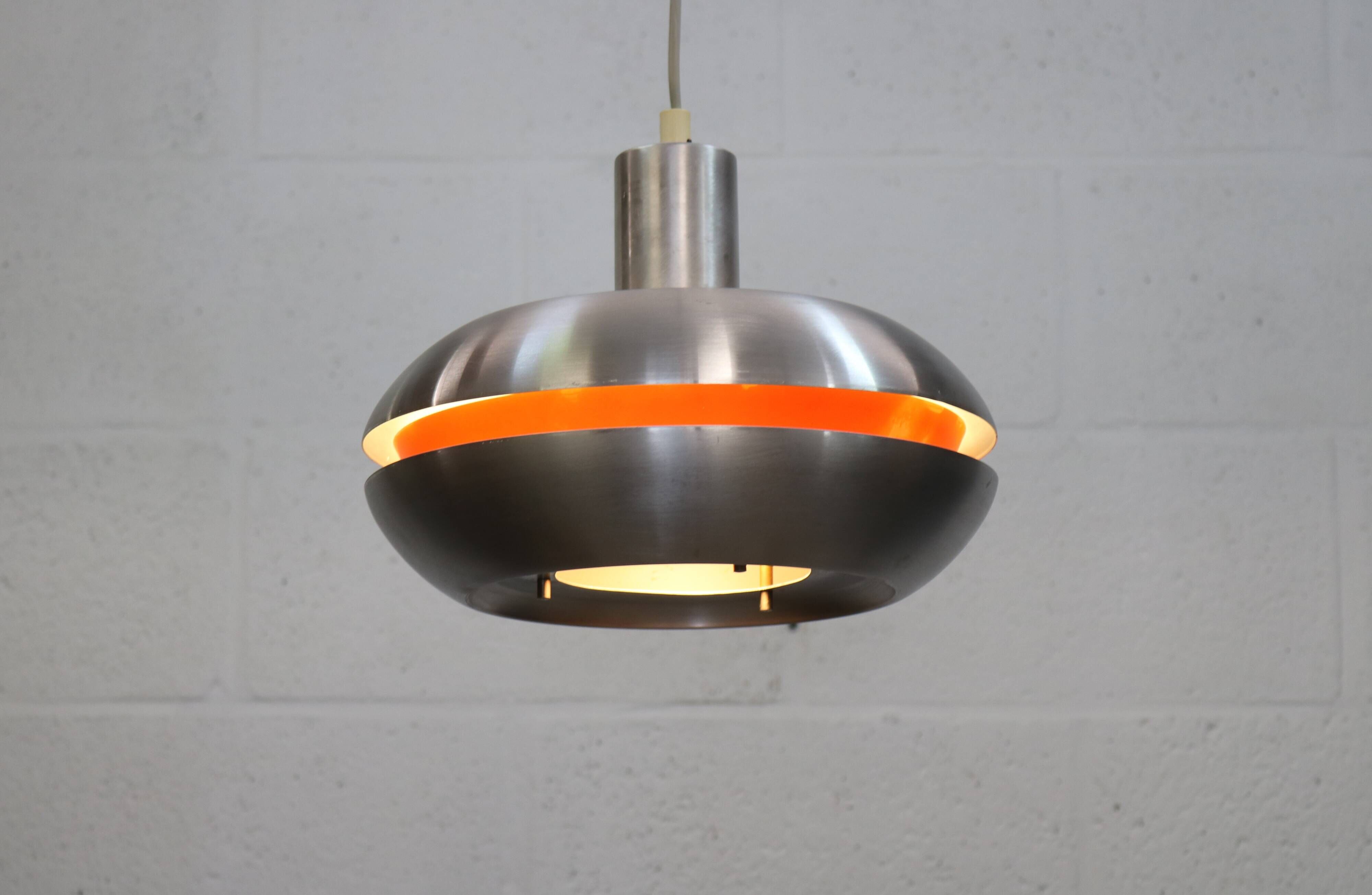 Old Danish space age design lamp in alu and orange inside.