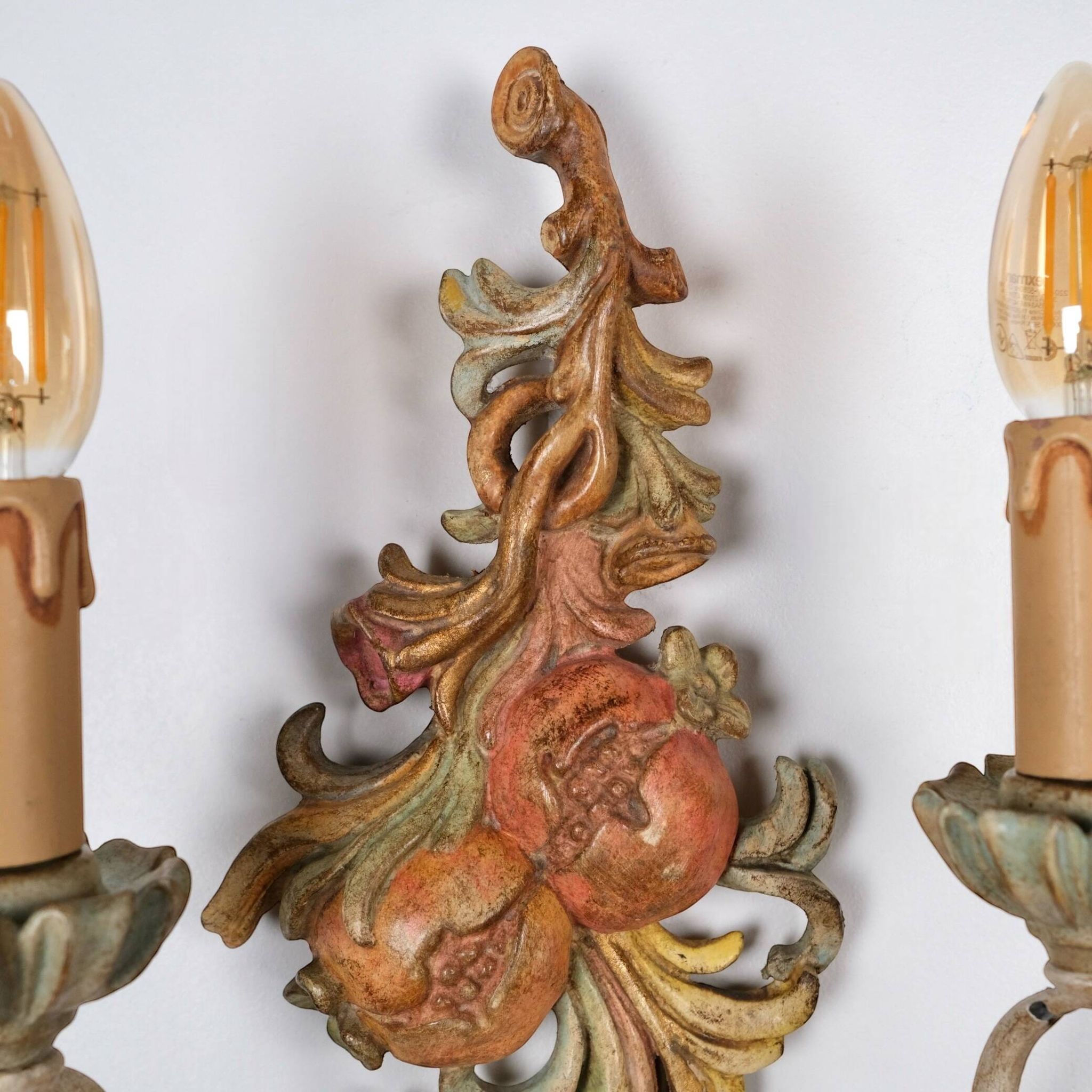 Pair of carved wood and metal sconces, Chelini FIrenze, Italy