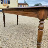 Old French farmhouse table in walnut with turned legs.