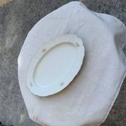 Large yellow porcelain serving dish by Bernadotte from the 1960s, with a gold rim and relief.