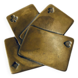 Empty pocket square of aces in brass