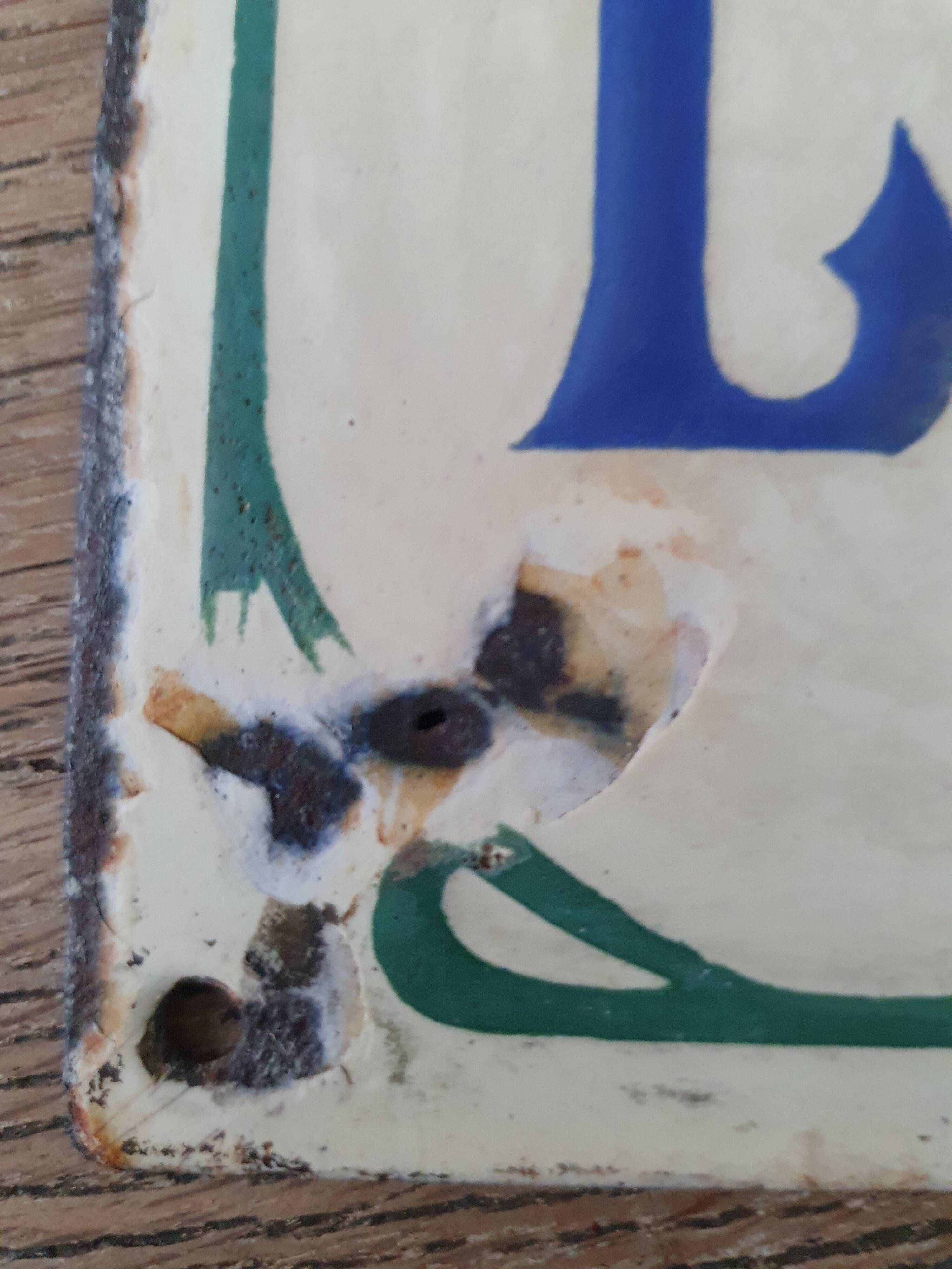 Old enameled house plate