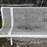 Old perforated metal garden bench