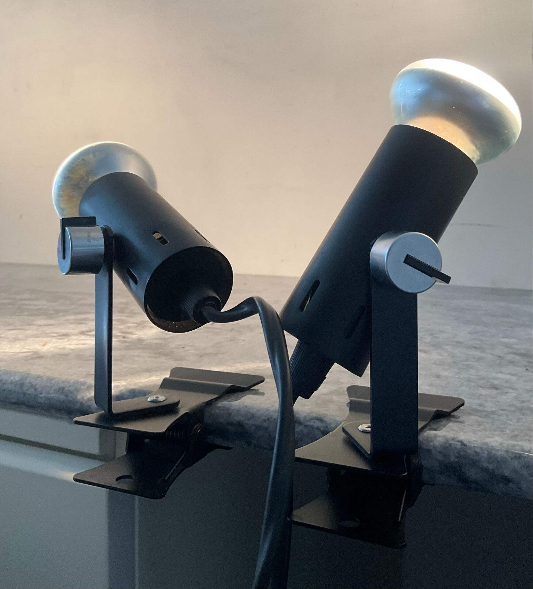 A pair of clamp lamps from the 1970s.