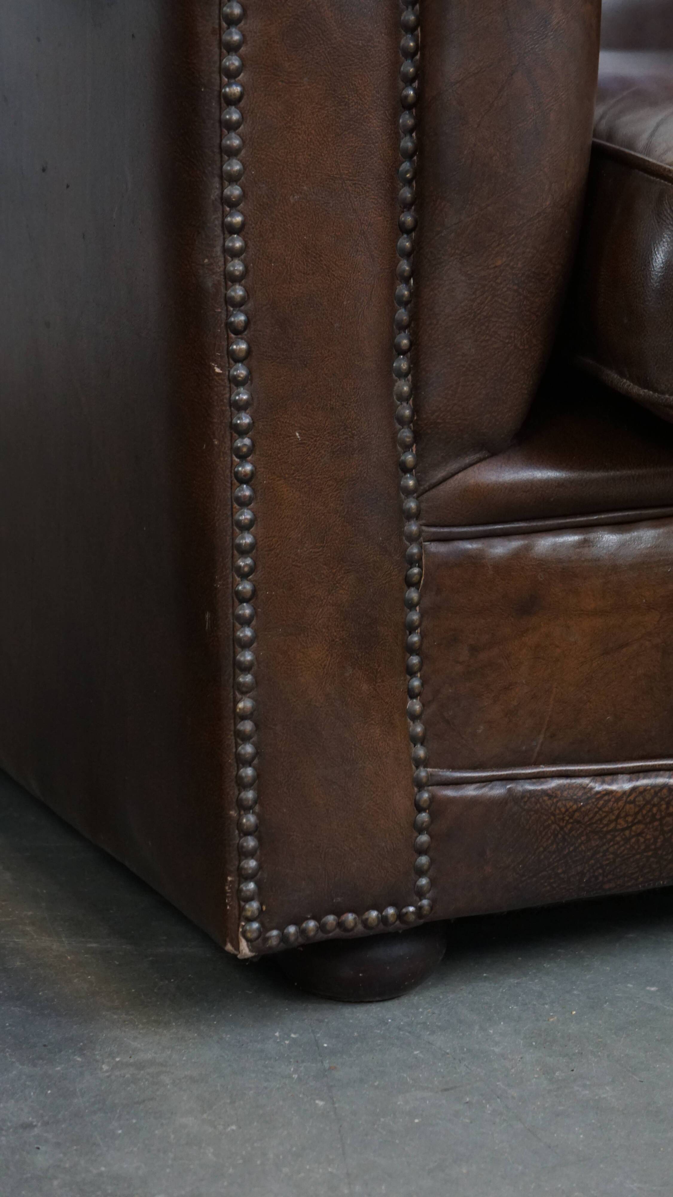 2 Chesterfield armchairs in dark brown cowhide