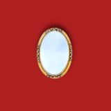 Small vintage oval mirror in gilded resin – 1960s