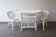 White rattan table and chairs set.