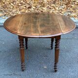 Louis Philippe oval drop-leaf table in solid wood, 19th century