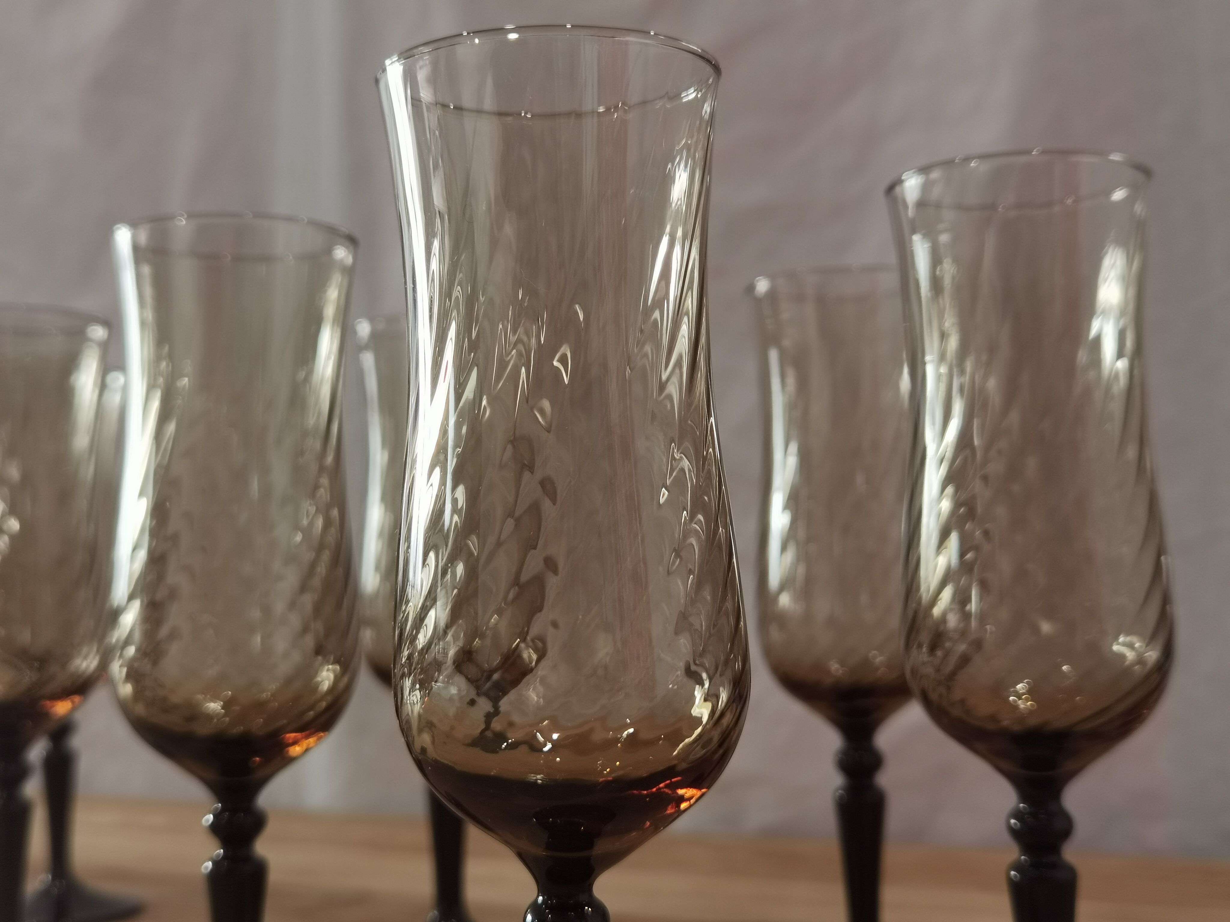 8 vintage smoked champagne flutes with black feet Arcoroc