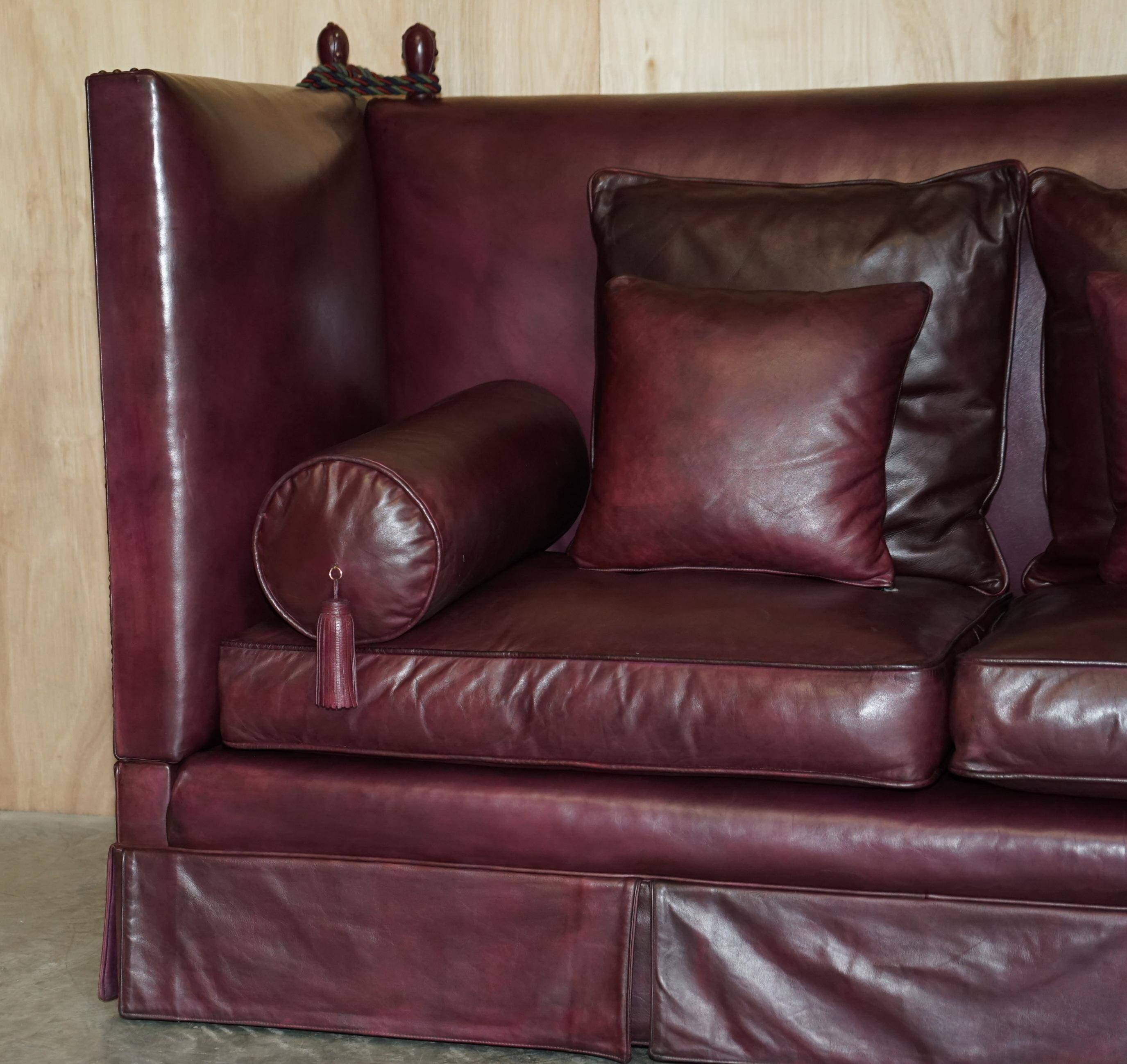 Victorian Knole canapé restored in leather with feather cushions.