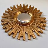 Old large golden sun mirror with rounded witch's eye in vintage resin from the 70s