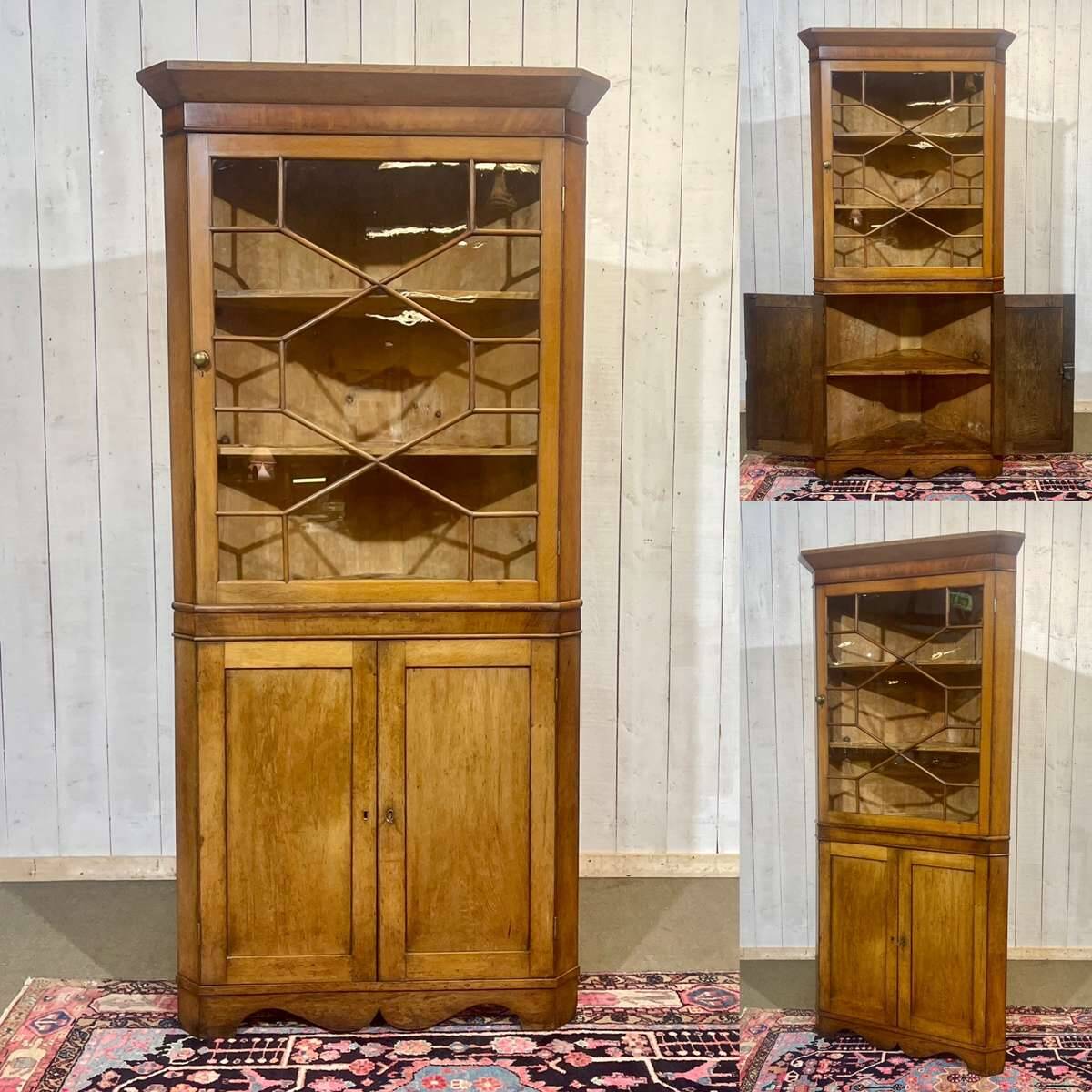 19th-century English corner cabinet in oak, mahogany, and fir.