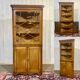 19th-century English corner cabinet in oak, mahogany, and fir.