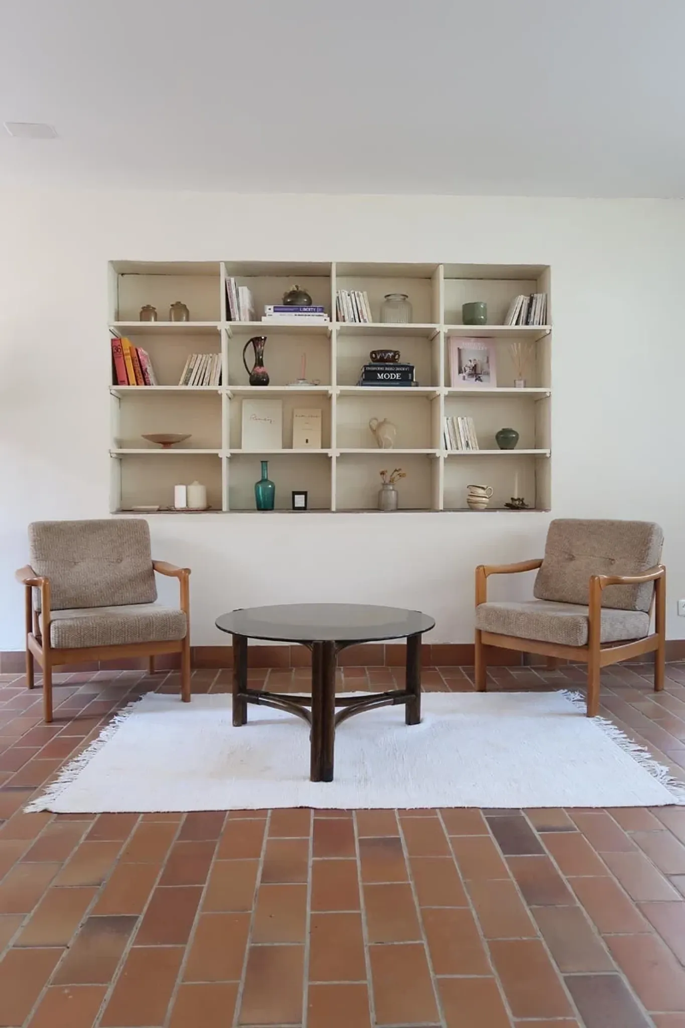Round coffee table in rattan and smoked glass — 1970s
