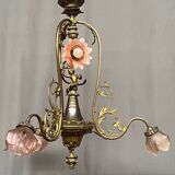 Renaissance chandelier with putti statuette.