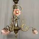 Renaissance chandelier with putti statuette.