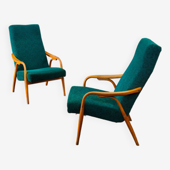 Pair of green armchairs with high backs by Antonin Suman