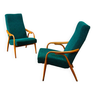 Paire de fauteuils vert dossier haut par Antonin Suman