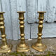 4 Victorian brass candlesticks