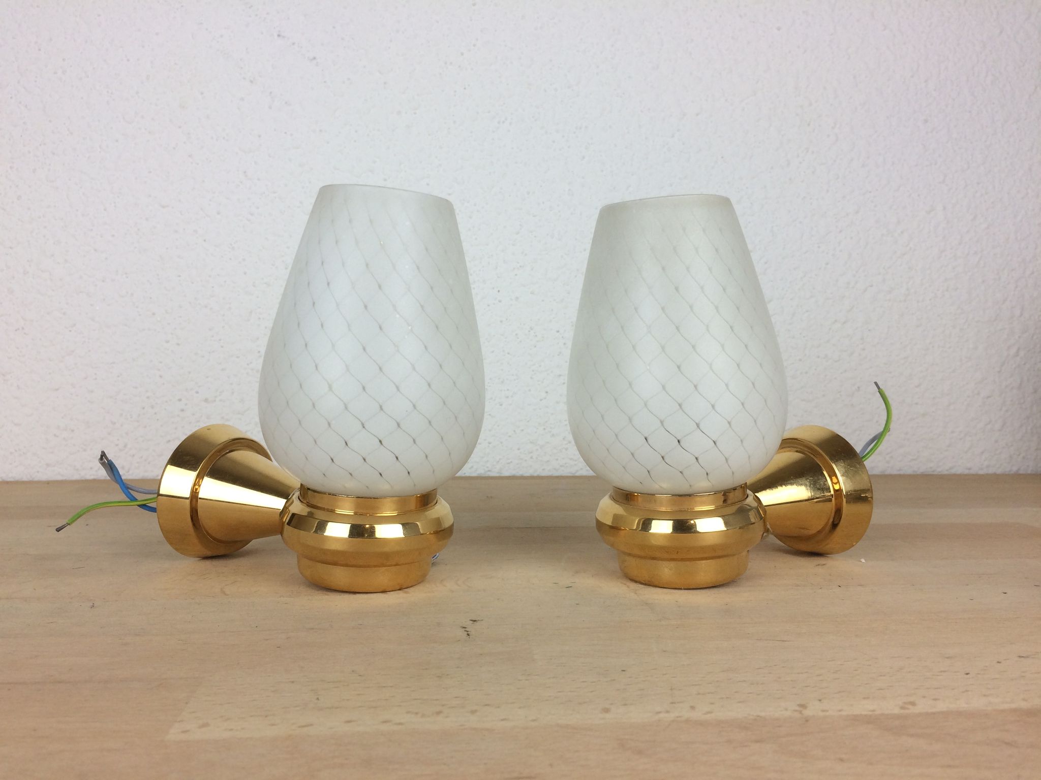 Pair of solid brass and white opaline wall lamps