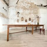 Solid wood workshop table with straight legs.