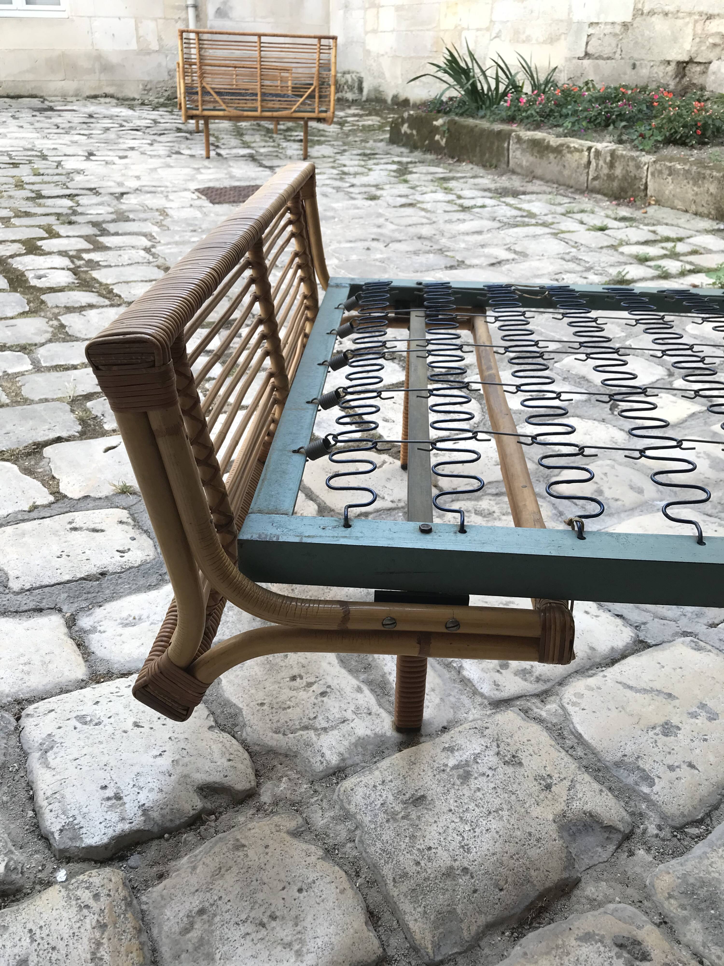 Twin rattan beds with built-in bedside tables