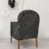 Club armchair in wood and fabric.