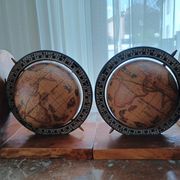 Pair of vintage bookends with rotating terrestrial globes on wooden bases in Spain