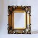 Pair of old carved wooden and plaster frames