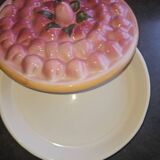 Glazed ceramic dessert plate with strawberry design.